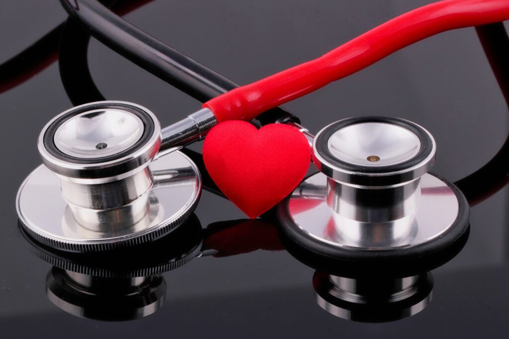 a stethoscope and a heart on a table